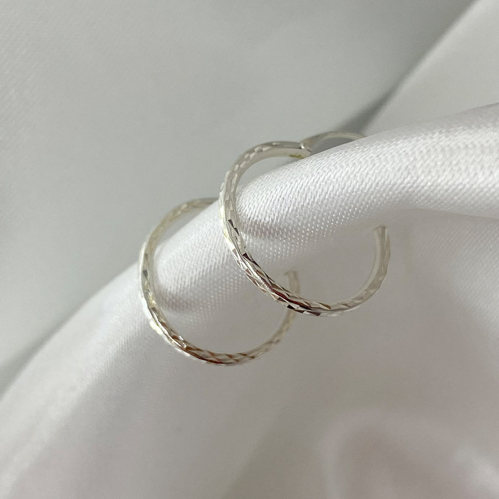 Faceted hoop earrings 18mm. silver