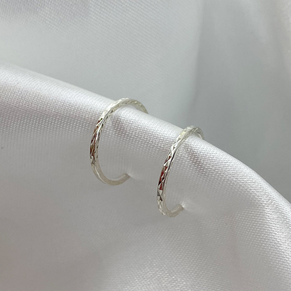 Faceted hoop earrings 18mm. silver